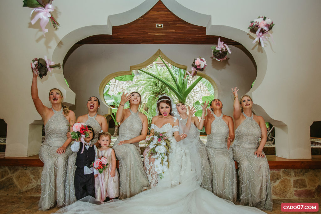 Bride and bridesmaids posing for a group portrait
